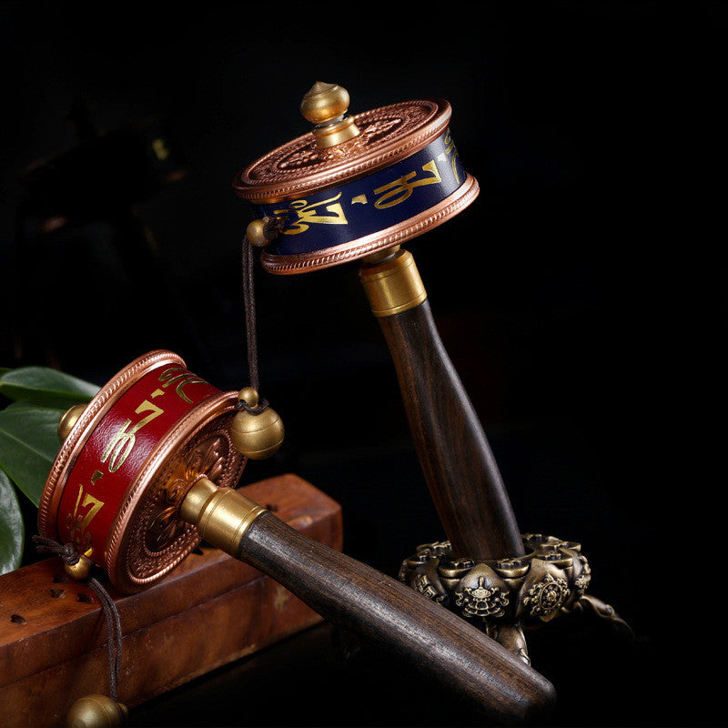 Tibetan prayer wheel in copper six syllables